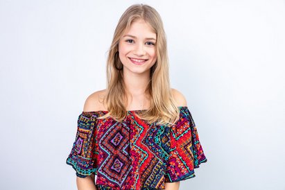 smiling-young-blonde-woman-looking_141793-125687
